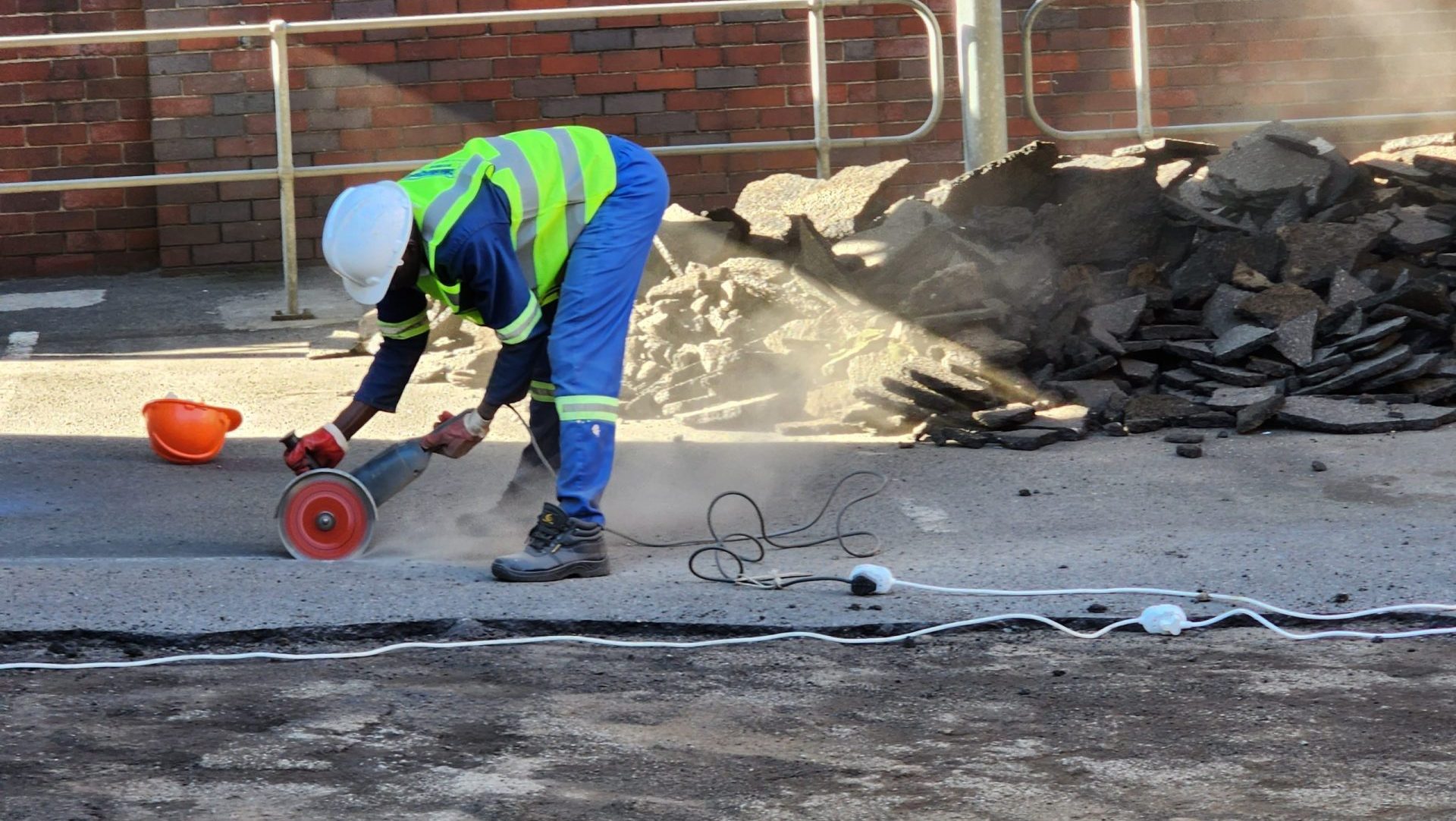 Cutting Old Tar for removal